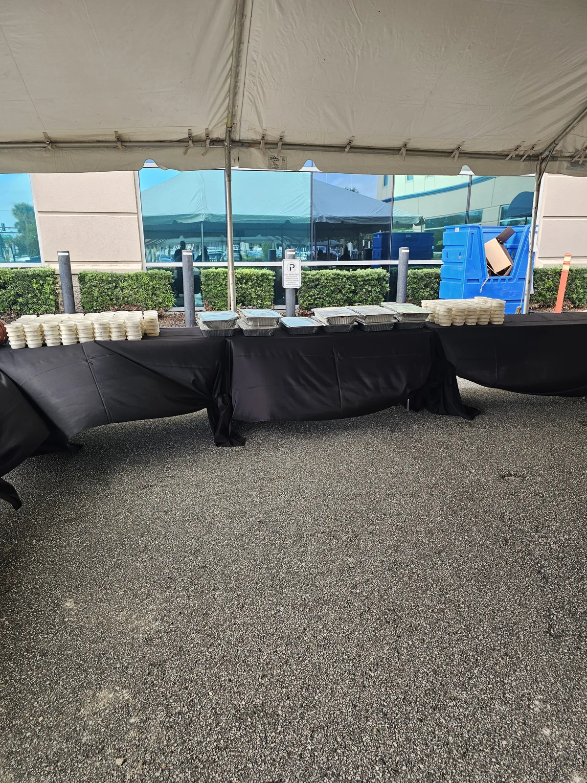 Prepared catering pans and individual dessert cups ready for service